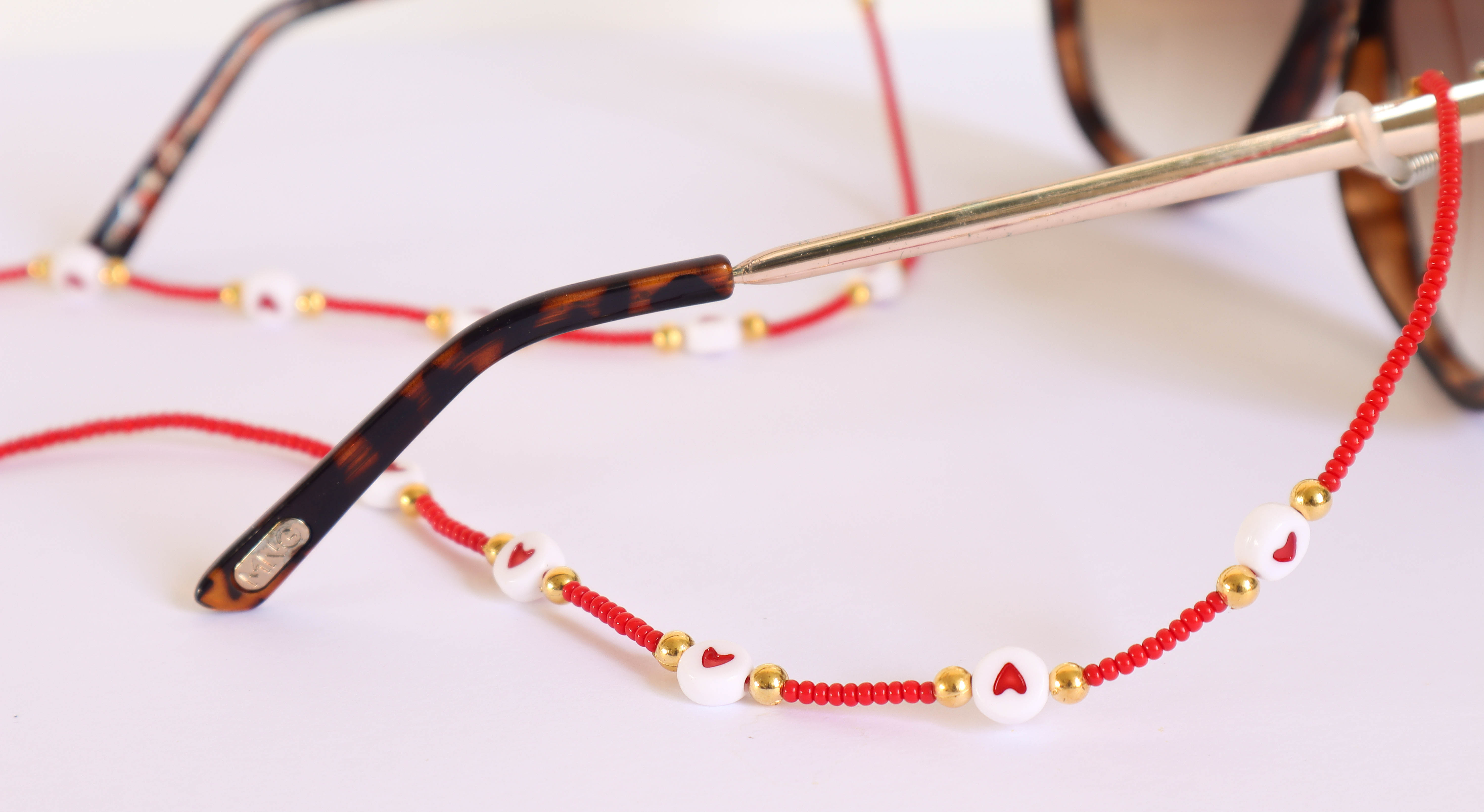 TIRA DE GAFAS ROJA
